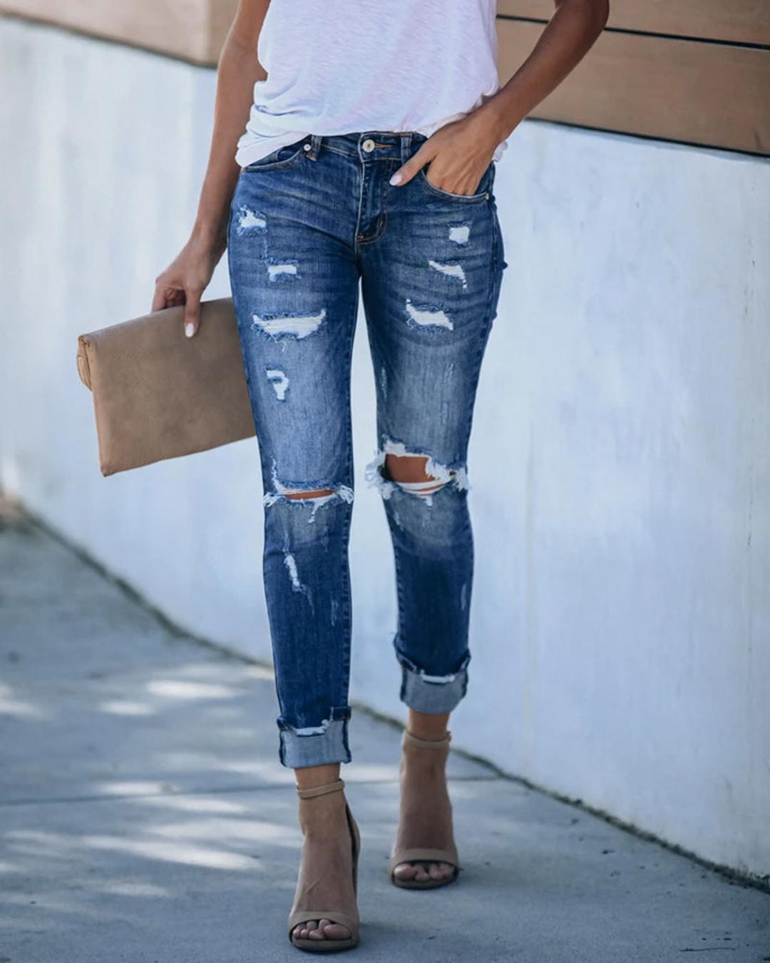 Universal Mid Rise Distressed Skinny Jeans